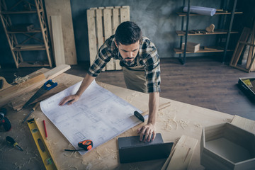 Top above high angle photo of concentrated focused wood worker have canvas with building construction plan use computer watch handwork videos in house home garage