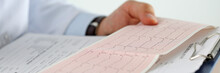 Male Medicine Doctor Hands Holding Cardiogram Chart