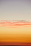 Fototapeta Zachód słońca - The golden sunset sky over the Pacific Ocean