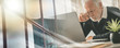 © thodonal - Tired senior businessman sitting in office; multiple exposure