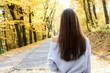 © RomanR - Portrait of brunette woman in casual wear in autumn park. Yellow colours around beautiful woman