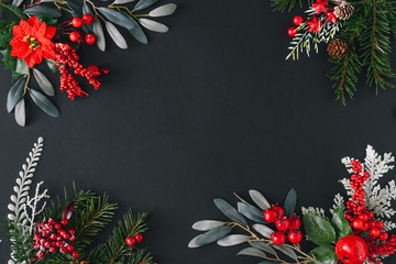 Wall Mural - Christmas dark background made of natural winter things. Flat lay border frame with copy space.