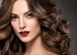 © Utkamandarinka - Curly hair woman beauty makeup female healthy hairstyle fashion make up brunette