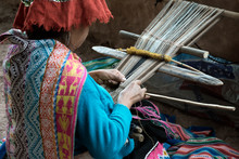 Peruvian Woman Weaving Cloth On A Hand Loom