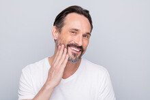 Closeup Photo Of Handsome Positive Aged Man Looking Mirror Toothy Smiling Hand Checking Beard After Using New Shaving Gel Wear White T-shirt Isolated Grey Color Background