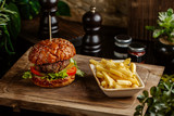 Fototapeta Nowy Jork - small beef burger served with fried potatoes