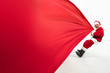 © master1305 - Santa Claus pulling huge bag full of christmas presents isolated on white background. Caucasian male model in traditional costume. New Year 2020, gifts, holidays, winter mood. Copyspace for your ad.