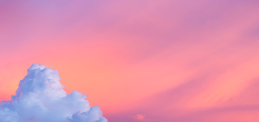 Wall Mural - Fantasy colorful aerial view background, Pink sunlight on colorful sky and purple mountain cloud before sunset