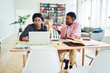 © BullRun - Serious male and female students having discussion and disagreements during working process at bright room, african american woman gesture ignore man's explanation looking at laptop computer.
