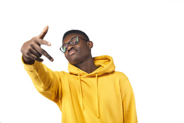 Wall Mural - young black man in yellow hoodie in glasses