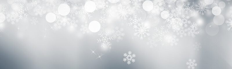 Wall Mural - white and gray Christmas light with snowflake bokeh background, Winter backdrop wallpaper.