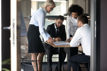 Wall Mural - Multiethnic businesspeople brainstorm considering ideas in office