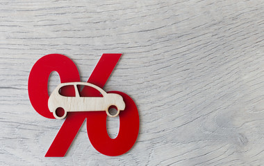 Car model and percent sign as a symbol of discount.