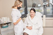 © Alexandra Grua - Woman gets beauty facial injections. Anti-aging, nourishing, vitamins treatment at spa salon. Aesthetic cosmetology. Doctor talking to a beauty salon client