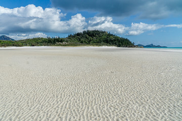 Wall Mural - the white beach of the Whitsunday Islands in Australia, which consists of 99 percent quartz sand, and the azure blue sea