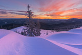 Fototapeta Most - Colorful winter dawn on the mountain valleys in the Ukrainian Carpathian Mountains.	