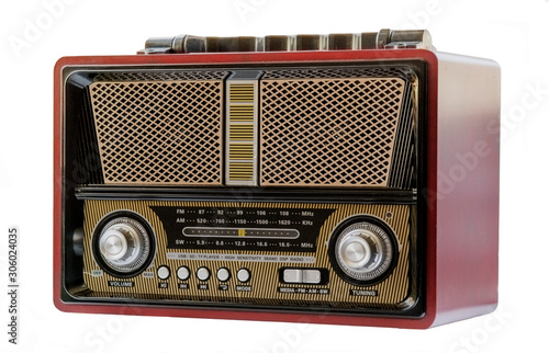 Fotografía radio antigua, tradicional de color rojo oscuro, negro, dorado ,amarillo y plate