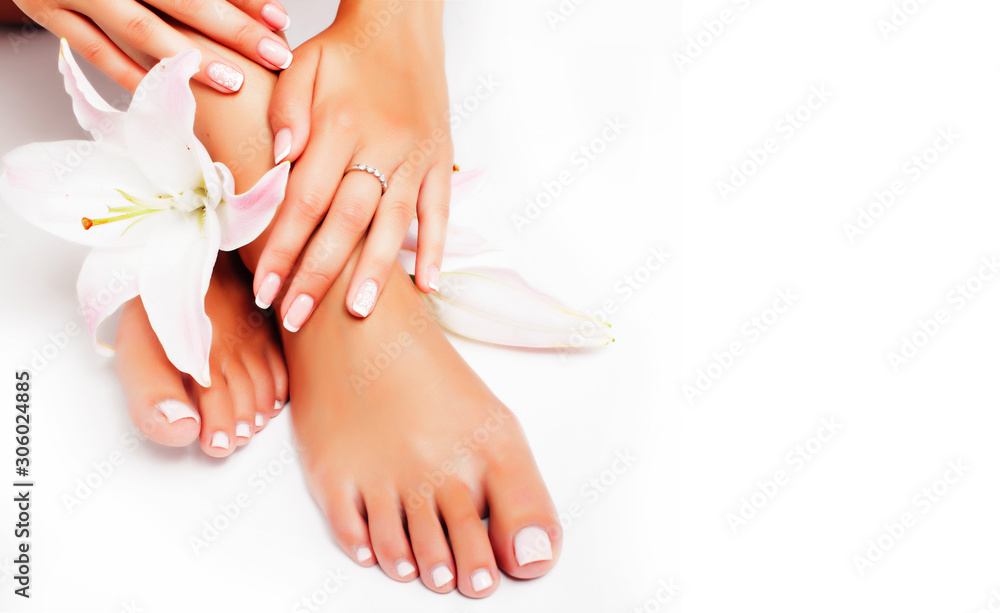 manicure pedicure with flower lily closeup isolated on white perfect shape hands spa salon - obrazy, fototapety, plakaty 