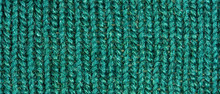 Green Knitting Wool Texture. Cloth Background Close Up