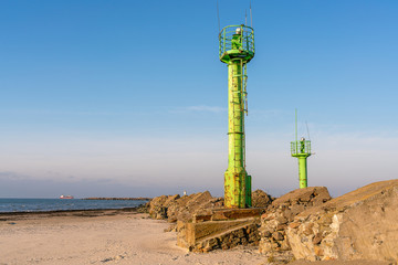 Two lighthouses and a breakwater at the entrance to the port.