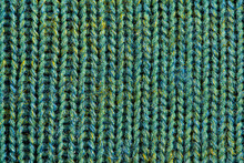 Green Knitting Wool Texture. Cloth Background Close Up