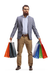 Poster - Bearded man standing with many shopping bags