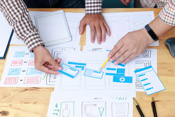 Wall Mural - graphic designers work together with ux ui designer planning application template layout framework f