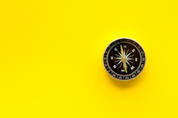 Wall Mural - Compass - small and stylish - on yellow background top view copy space