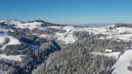 Wall Mural - Aerial view of a snow-covered winter landscape in Entlebuch, Canton Lucerne, Switzerland