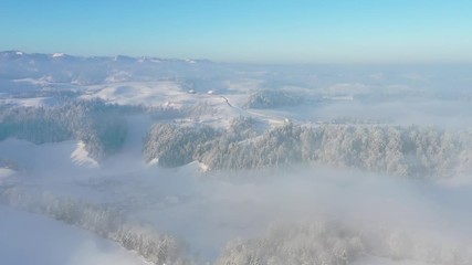 Wall Mural - Aerial view of the foothills of the Alps on an ice-cold winter morning with fog and fresh snow, Lucerne, Switzerland