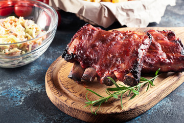 Wall Mural - Spicy barbecued pork ribs served with BBQ sauce