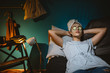 © cherryandbees - woman relaxing in her room with cosmetic face mask applied on her face