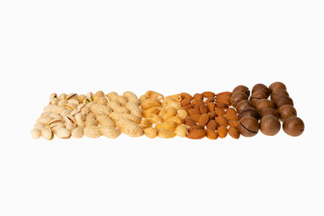 Wall Mural - Isolated nuts pattern backdrop. Peanut, pistachio, cashew, almond, macadamia on white background.