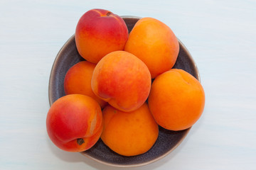 Wall Mural - fresh apricots in a bowl