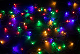 Fototapeta Pokój dzieciecy - Christmas garland lights on darck background