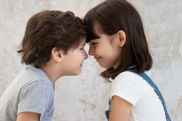 Canvas Print - Close up of little siblings look in eyes showing love