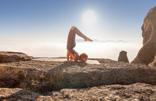 Girl Practices Yoga In The Mountains