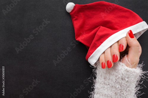 Cuadros en Lienzo Woman hand in white fluffy jumper with hat