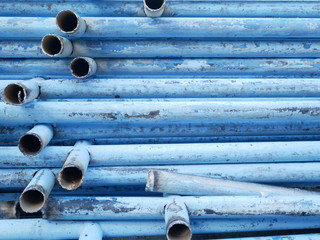 old metal pipe background, used steel pipe, recycle blue aluminum tube