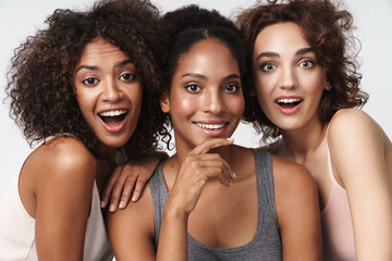 Wall Mural - portrait of beautiful multiracial women standing together and smiling