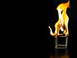 Burning match house with black background, fire house model property Insurance