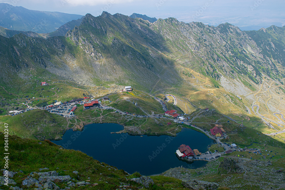Panorama from 2000 meters altitude where you can see Bâlea Lac, Bâlea Lac chalet and Transfăgărășan road. Picture taken on 03.09.2019. - obrazy, fototapety, plakaty 