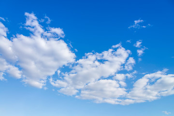 Wall Mural - Blue sky with close up white fluffy tiny clouds background and pattern