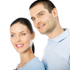 Portrait of young happy smiling lovely couple looking up, isolated over white background