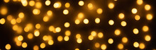 Abstract Golden Bokeh Light Festive Holiday On Black Background