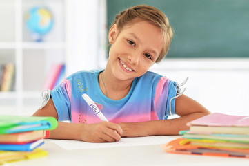 Poster - Portrait of cute little girl drawing at home