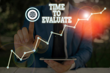 Wall Mural - conceptual hand writing showing time to evaluate. concept meaning moment rate used before products o