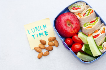 Wall Mural - Lunch box with tortilla wraps, fruits and vegetables. Healthy eating concept.