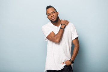 Wall Mural - Portrait of handsome young African American man looking at camera