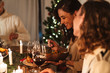 © Drobot Dean - Photo of caucasian joyful people eating while having Christmas dinner